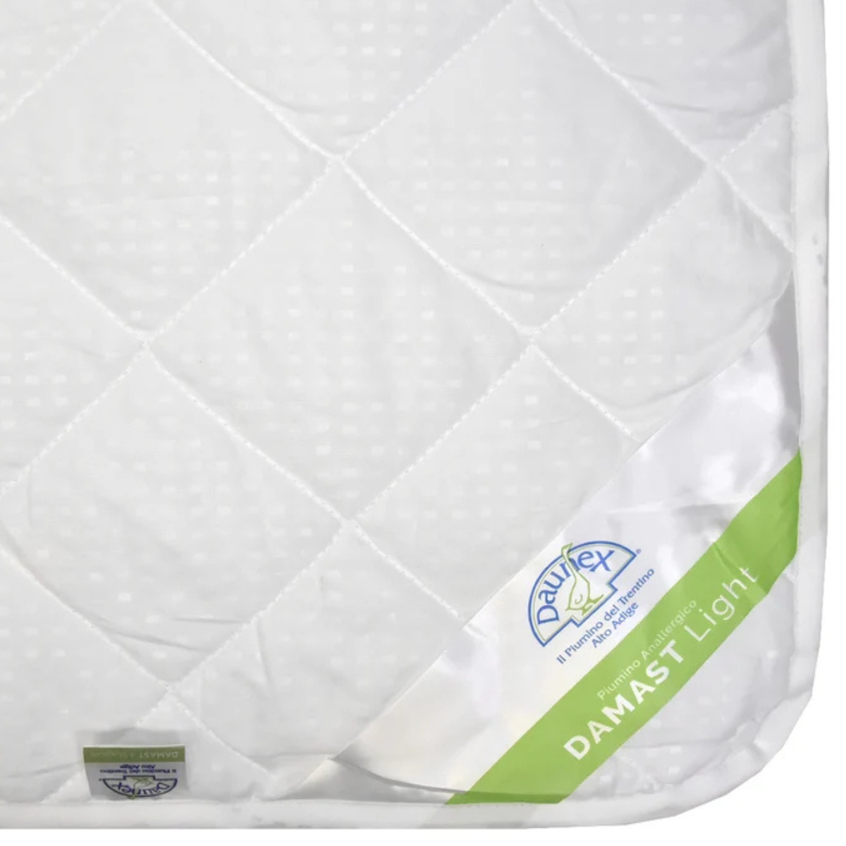 Dettaglio piumino Daunex Damast Light con trapuntatura a rombi e tessuto embossed