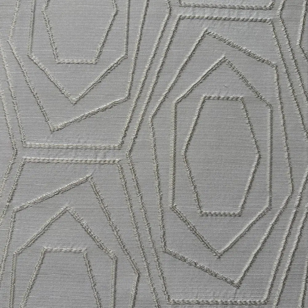 Particolare della lavorazione jacquard con figure geometriche concentriche in tonalità neutra